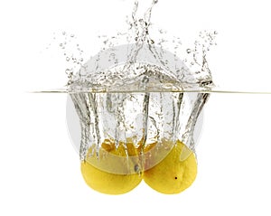 Lemon drop in fizzy sparkling water, juice photo