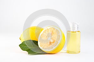 Lemon essential oil and lemon fruit isolate on white background