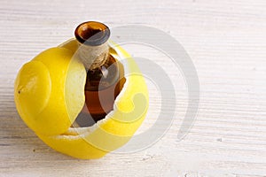 Lemon essential oil on a white background