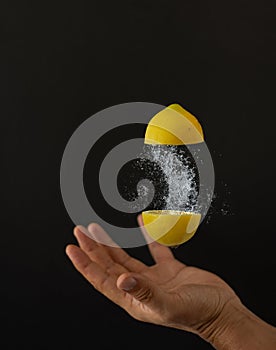 a lemon explosion over a hand