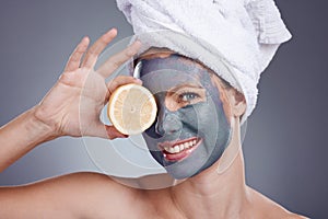 Lemon, face mask and portrait of woman, healthy skincare and beauty of anti aging wellness makeup in studio. Happy