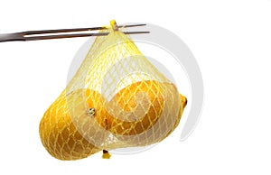 Lemon on a fork in a net