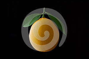 Lemon fruit with leaf isolated on black background