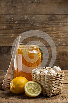 Lemon, garlic and jar of honey