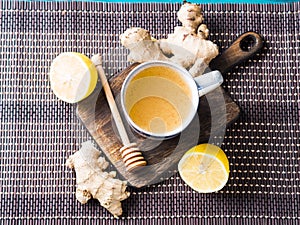 Lemon ginger hot tea drink with honey as natural remedy