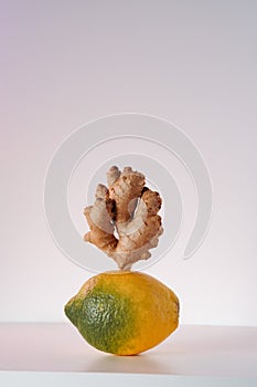 Lemon and ginger root on white background