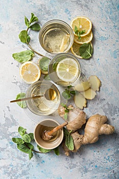 Lemon and ginger tea with honey. Healthy ingredients against cold. Top view image  with copy space. get rid of toxins and boost