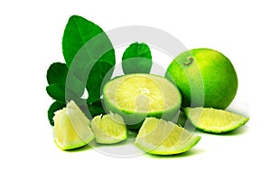 Lemon and green leaves with lime juice