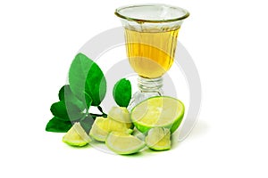 Lemon and green leaves with lime juice