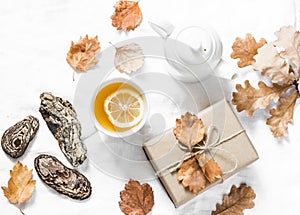 Lemon green tea, homemade gift, autumn mood on a light background, top view. Cozy autumn home still life.