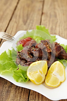 Lemon with grilled meat