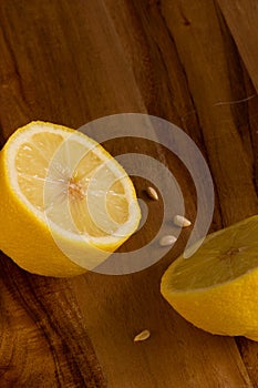 Lemon halves on wooden board background with copy space