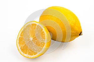 Lemon isolate on white. Lemon fruit whole and a half with leaves. Side view on white. With clipping path