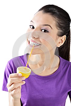 Lemon juice drinking woman