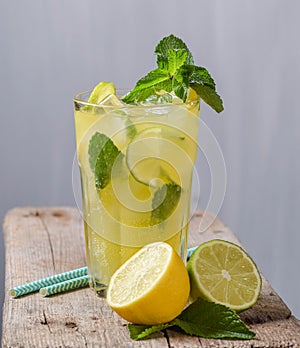 Lemon juice on glass with mint ice white background lemonade drink cold summer