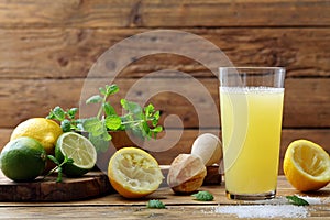 Lemon juice in glass rustic background