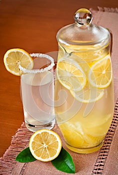 Lemon juice in a jug and fruit