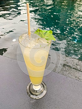 Lemon juice mojito cocktail put over resort pool