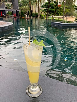 Lemon juice mojito cocktail put over resort pool