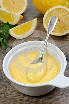 Lemon kurd - custard on fruit juice photo