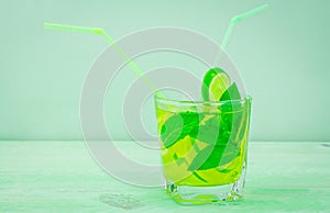 Lemon lime and mint drink cocktail with straw