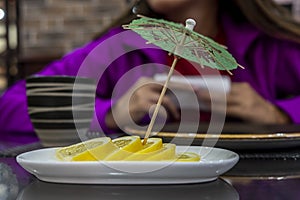 Lemon lobules with umbrella toothpick. Tea time.
