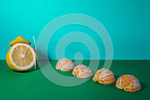 Lemon and mandarin on a blue background