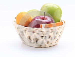 Lemon mango apple in the basket isolated on white background