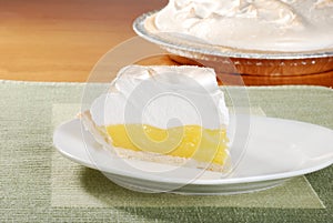 Lemon meringue pie on green placemat photo