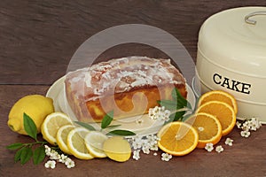 Lemon and Orange Drizzle Cake with Fruit and Blossom Flowers