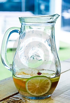 Lemon and orange in jar glasses