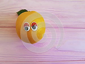 Lemon orange funny cartoon friendly eyes wooden personage