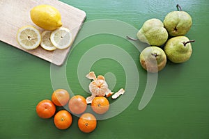 Lemon, pear and tangerine for preparing smoothie