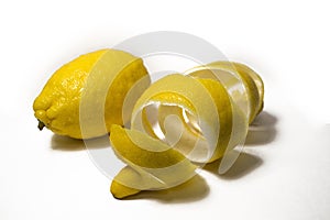 Lemon peel or lemon twist on white background. Close-up.