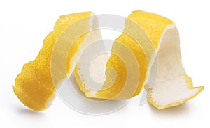 Lemon peel or lemon twist on white background. Close-up.