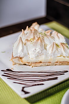 Lemon pie slice in a white plate photo