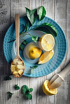 Lemon pieces on blue plate closeup