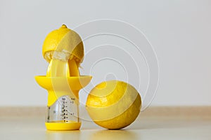 Lemon placen on juice squeezer maker photo