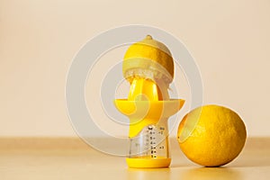 Lemon placen on juice squeezer maker photo