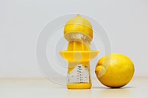 Lemon placen on juice squeezer maker photo