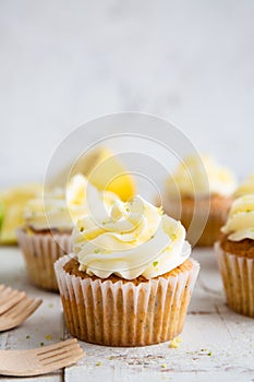 Lemon and poppy seed cupcakes with cheese cream frosting