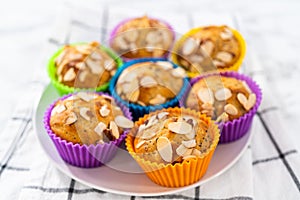 Lemon poppy seed muffins garnished with almond slivers