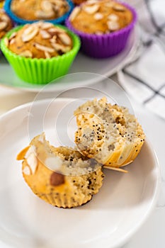 Lemon poppy seed muffins garnished with almond slivers