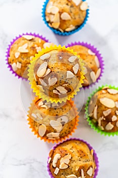 Lemon poppy seed muffins garnished with almond slivers