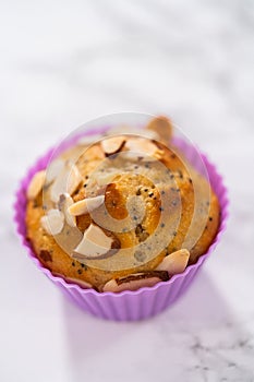 Lemon poppy seed muffins garnished with almond slivers