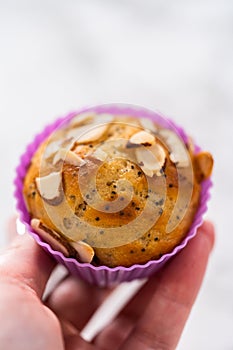 Lemon poppy seed muffins garnished with almond slivers