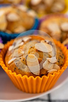 Lemon poppy seed muffins garnished with almond slivers