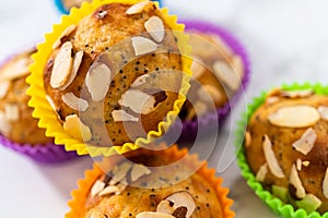 Lemon poppy seed muffins garnished with almond slivers