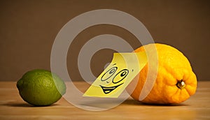 Lemon with post-it note looking at lime