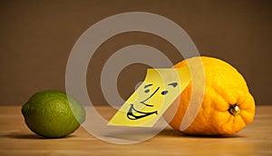 Lemon with post-it note smiling at lime